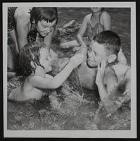 Lawrence recreation commission - wading pool in South Park - Candy Kay Allen splashing Bud Gillespie, Jr.