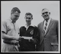 Lawrence Civic Clubs - Kiwanis (L to R) Bob Schwanzle; James Dwyer; George Anderson - with check to purchase sheep for Dwyer.