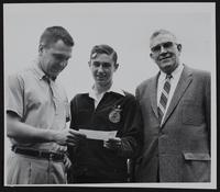 Lawrence Civic Clubs - Kiwanis (L to R) Bob Schwanzle; James Dwyer; George Anderson - with check to purchase sheep for Dwyer.