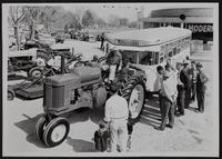 Farming display of LP Gas for tractors - Lloyd Deems, John Deere Dealer, on tractor.