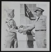 Master Sergeant Edwin S. Young receiving award of &quot;Best Solider in the Regiment&quot; from Captain Karl Reber of Kansas National Guard.