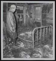Fires - Tonganoxie - where three children died - Children of Mrs. and Mr. Richard Skaggs. (A) General view of rear of building. (B) Fred Needham looks over Skaggs bedroom. (C) Tonganoxie, Linwood and Basehor firemen and front of building in Downtown. (D) view of front of building.