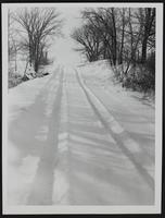 Weather - snowfall (a) Jimmy Sumneo and Gary Adams. (b) View about five miles west of Lawrence (c) Lane at Charles Topping farm. (d) scene of us 40 west of Lawrence. (e) Raymond ice farm west of Lawrence.