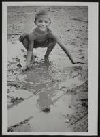 Lawrence Weather - Bobby Brink in mud puddle.