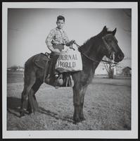 Journal World carriers- Arland Richardson and his horse Blackjack.