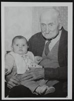 Lawrence E.G. Day of 946 1/2 Rhode Island street on his 100th birthday with his great grandchild Gertrude Hadl.