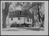 House being moved from site of Catholic Church School to South Lawrence thru South Park.