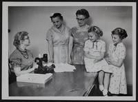 HDU - (L to R) Paula Glover, HD Agent; Mrs. Nathan Lynch; Mrs. John E. Riley; Virginia and Linda Wulfkuhle.