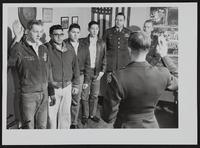 Kansas National Guard new signees (L to R) Richard Colbert; Olen Alberson; Richard Powell; John Hummingbird; Captain Karl Reber; CWO Donald L. Ousdahl. Lt. Robert W. Atchison (foreground)