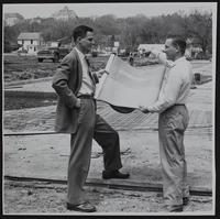 Lawrence Officials - City Planner Bob Kipp and City Engineer E. J. Allison (right) at paving project at 19th street and Ohio.