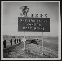 Kansas Turnpike - KU sign on right of way.