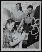 Girl Scouts - preparing for fair (L to R) Marilyn Grantham; Anna Marie Icks; Eugenie Wilson.