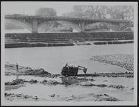 Kaw River - Low water allows bulldozer to remove stone rubble below dam.