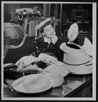 Women&#39;s styles - Mrs. Keith Young - choosing a hat.