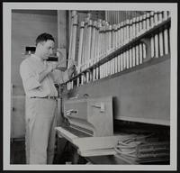 Lawrence Industries - Reuter Organ co. Herbert Kampschroeder shapes opening in pipes.