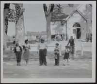 Lawrence Schools - Undersheriff Charles Edmondson assists children across US Highways 24-59-40 at White School near Teepee Junction.