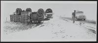 Auto Wrecks - Truck driven by Robert Mills of Tonganoxie overturned on snowy road.