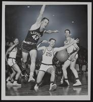 LHS Basketball - Joe Malott (42) Atchison&#39;s Tom Wyrick (25).
