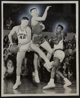 LHS Basketball vs. Leavenworth (L to R) Doyle Schick; David Edgell, Leav.; Carlton Hamm.