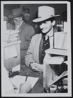 Autos - Early Tag recipient (probably) Russell Morgan (B) Inside treasurer's office (c) same.