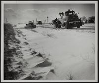 Snowstorm ties up Traffic. (Probably highway 10, east of Lawrence. CFCA plant at rear)