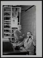 Tonganoxie - New Dial telephone system Mayor V. R. Trosper (right); Foster Laming, pres. Suburban Telephone Company, Inc.