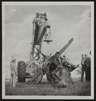 Pilot Lt. John T. Dixon, Wichita, was pulled from this burning navy plane near Olathe by John R. Newbold and Howard W. Seliff.