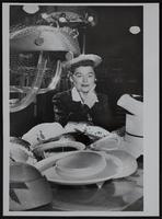 Women's styles - Mrs. Keith Young - choosing a hat.
