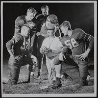 LHS football - Kneeling (L to R) Don Wrench, QB; Al Woolard, Coach; Buddy Bookwalter, RH; (Standing) Bob Craig, FB; Junior Smith, LH.