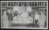 Junior High and Red Cross Christmas gift boxes. (L to R) Margaret Black, Jerry Schofer, Cynthia Parker, Jane Dunlap, Jane Dicker, Earle Westgate.
