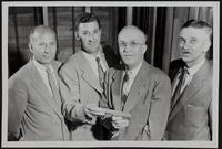 Lions Club presents check for house for Jess Layton (L to R) T. Murl Beal; Alfred Skeet; Walter Schaal; Harold Emick.