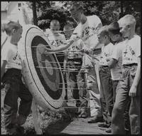 Young archers learn how to do it. At Camp St. Maur, Atchison by Rev. Owen Purcell, from (L to R) John Albers, Jimmy Breshears, Steve Patch, Jeff Triplett, Steven Hill, and Ed Cottle.