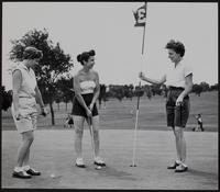 A Short Putt and Out. Ladies Day at the country club. Mrs. Gene Burnett, Mrs. John Crown, and Mrs. Wilbur Norton.