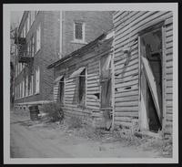 Lawrence Eyesores - wrecked house standing at rear of Presbyterian church at ninth and Vermont streets.