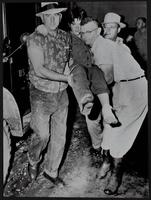 Survivor is rescued from clutches of hurricane Audrey in Cameron, LA.