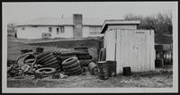 Lawrence Eyesores - Junk at rear of Wakarusa Township Hall on 23rd street with outside privy.