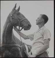 Early Arrival for big show. James A. Davies of Hutchinson arrives early for 1957 Lawrence Horse Show.
