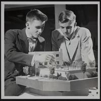 Lawrence Science Fair David Stoltenberg (left) and Gordon Culp Examine model of Garnett Plant.