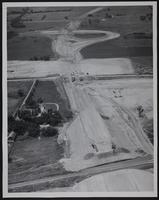 Kansas Turnpike - Construction of West Lawrence interchange Judge Nelson T. Stephens house at left.