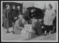 Disabled American Veterans - Christmas fruit packages (L to R) Standing - Mrs. Pearl Wolf; Mrs. Lucy Lambert; Mrs. Norma Thomas; Fred Snart; Mrs. Belle Kinney. Kneeling - Mike Kinney; Jerry Thomas.
