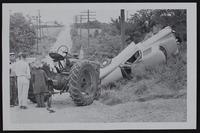 Tractor - Auto Accident - Arthur Johnson and Mrs. Fred Price, injured and tractor driver Don Larson was uninjured.