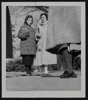 Coeds dress for cold wave - (Left) Susan Tyler, Sabetha; and Marilyn Claunch, KCMO.