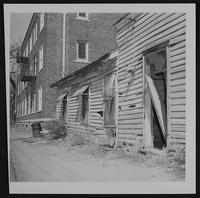 Lawrence Eyesores - wrecked house standing at rear of Presbyterian church at ninth and Vermont streets.