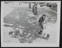 Weather - snowfall - cleaning snow at Phillips Service Station - SW Corner 6th and Michigan