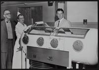 Polio - Iron lung purchased by LM Hospital (L to R) Dr. Fed R. Isaacs; Mrs. Mary Dunden H. K. Traul, Chairman of IOOF fund drive.