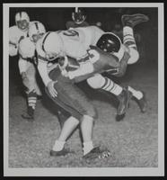 LHS Football vs. Wyandotte - Bob Craig stops Wyandotte&#39;s Bob Kohler.