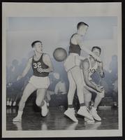 Haskell Basketball v. Osage City. OC&#39;s Gary Bolin (32) and Larry Rosetta and Haskell&#39;s Wayne Postoak.