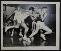 Haskell Basketball v. Osage City. Tom Sugar (left) of Haskell and Bolin of OC.