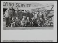 LJW - carriers win airplane rides (L to R) Standing Arlen Richardson; Delbert Richardson, pilot; Jesse Newman; Dave Rood; Charles Saunders; Whitney Westgate; J. D. Walker; Doyle Williams; Ron Newman; Dick Osborn; Pete Argersinger; Lewis Higgins; John Hines. (Front Row) Kenneth Lanon; Steve Glass; Bill Smith; Mike Pendleton; Ken Servos; Frank Hines; Elmer Goolsby; Ronnie Norris; Larry Barret.