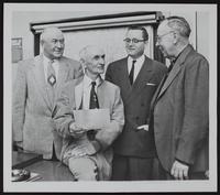 Douglas County Commissioners. (L to R) Charles Banning, Douglas Harris, County Clerk D. E. Mathia, Elmer Ousdahl.
